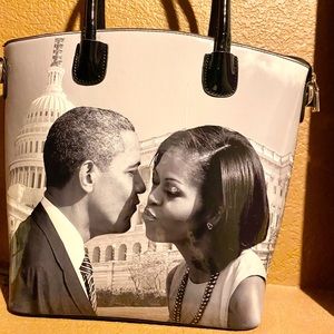 Light gray and Black patent leather purse.